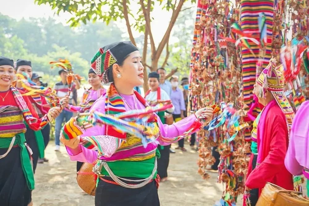 Cultural vibrancy in Muong women during a colorful festival.
