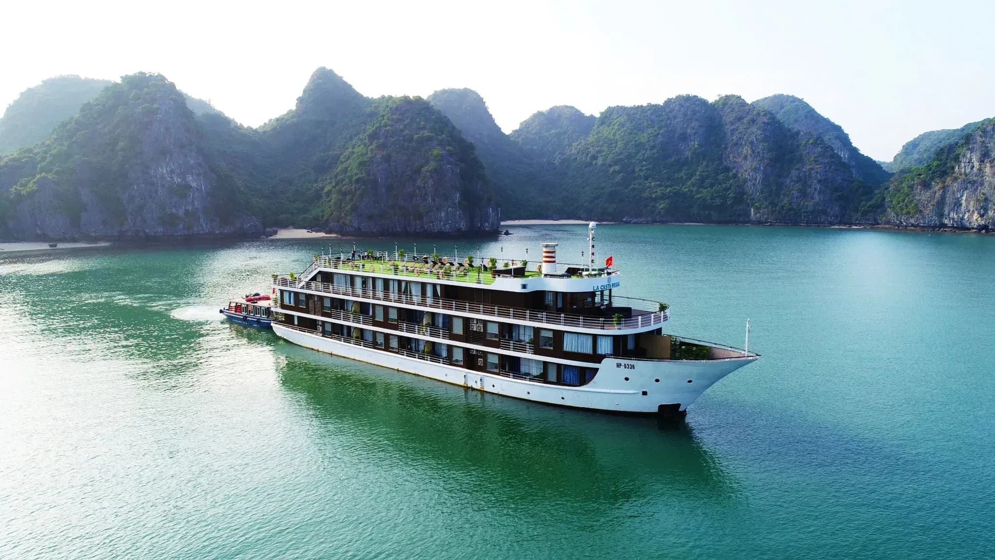 La Casta Regal cruise on the bay surrounded by lush green mountains