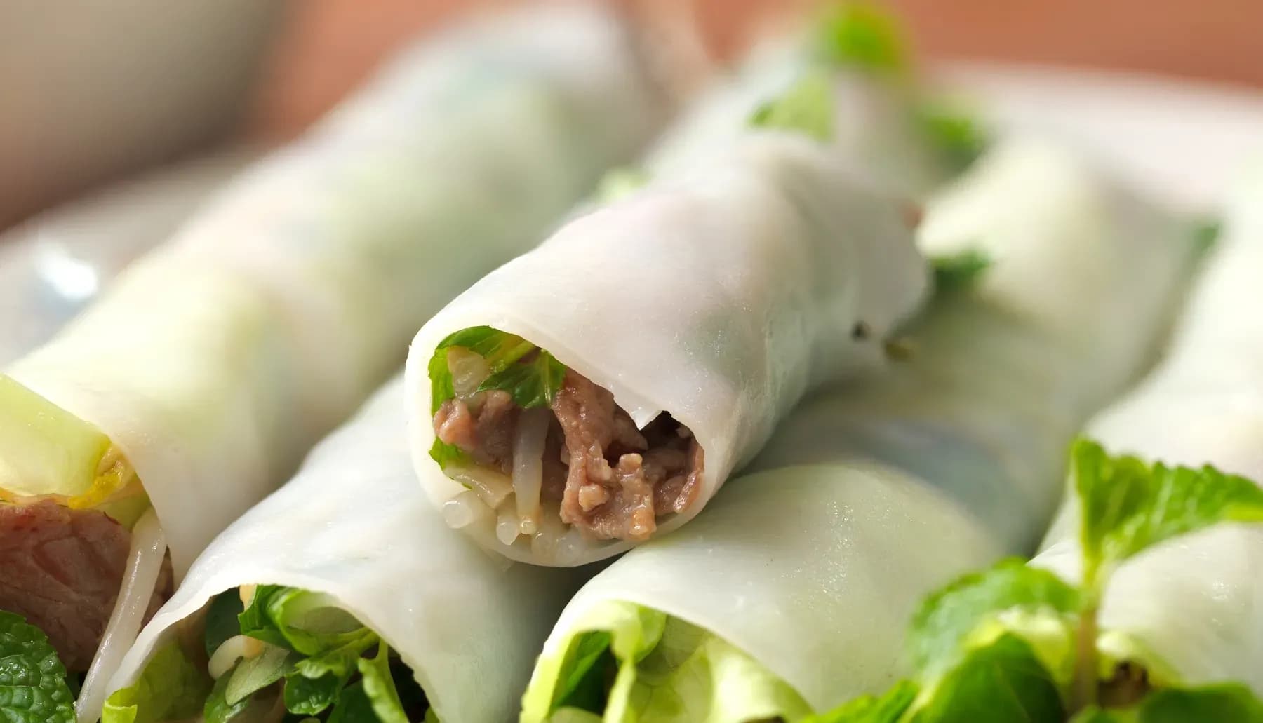 Pho cuon - a variation of beef pho in which thick rice noodles, cut into squares, are used to wrap stir-fried beef, lettuce, herbs, and dipped in sweet and sour papaya fish sauce. 