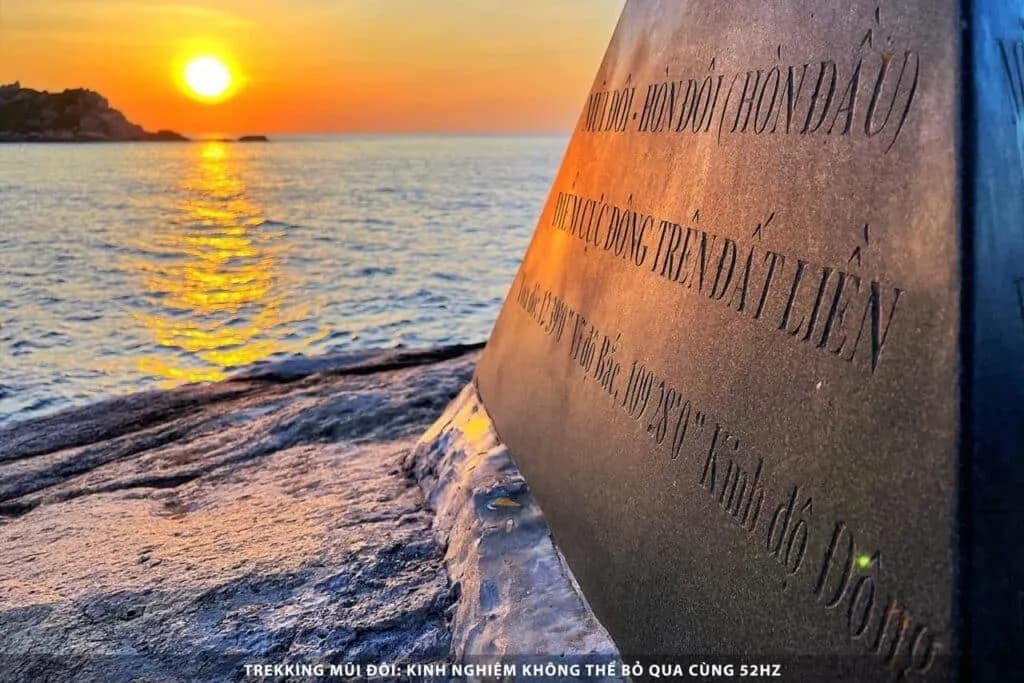 The dawn breaking beside Vietnam's easternmost marker at Mui Doi.