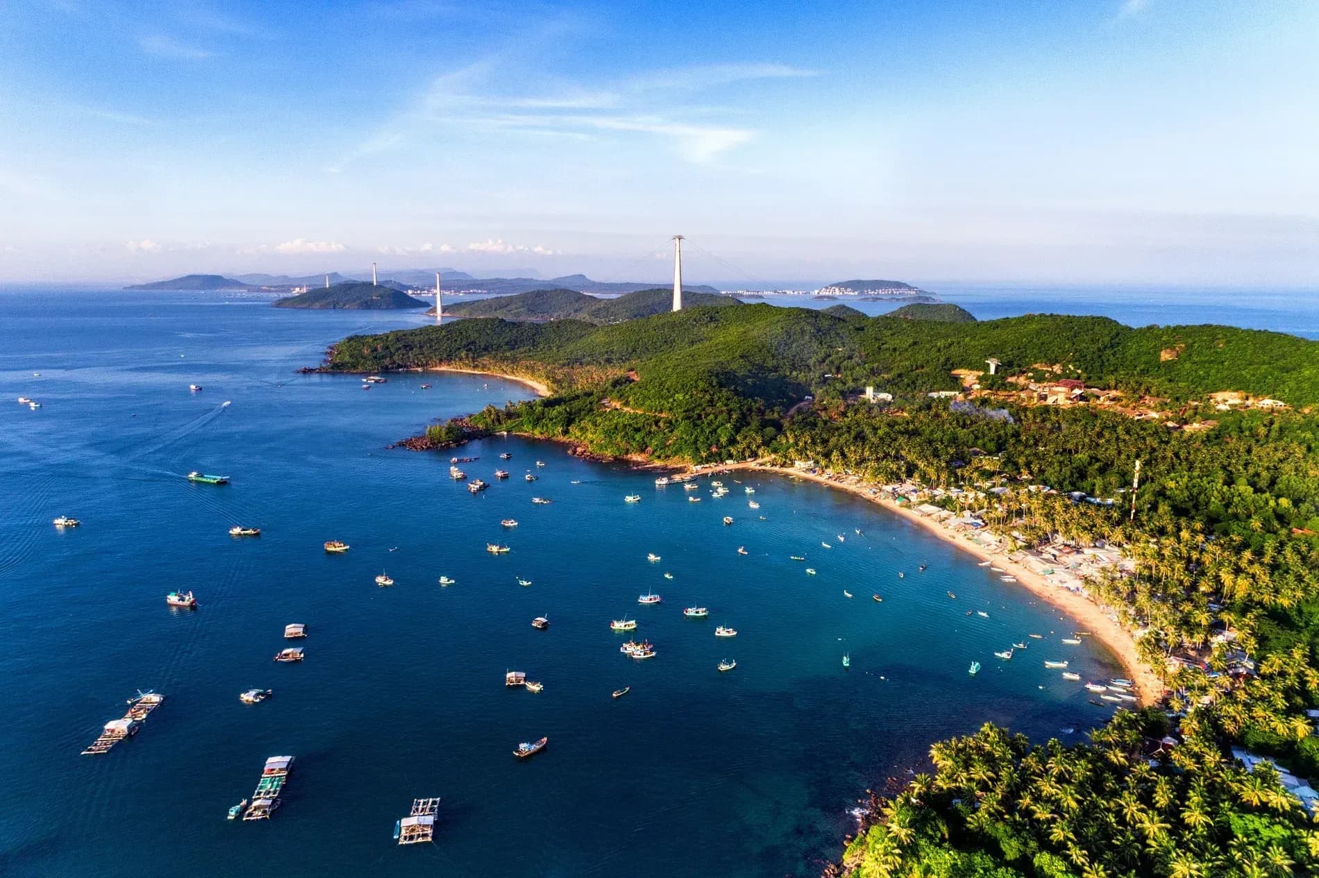 Phu Quoc's stunning view with blue seas and majestic mountains from above.