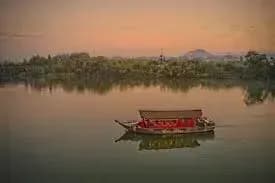  Azerai La Rive cruise with traditional design on the river at sunset.