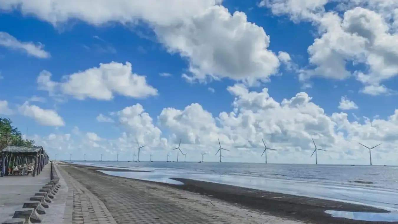 Wind farm and long sandy beach at Ba Dong Beach, Tra Vinh.