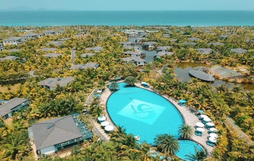 Duyen Ha Resort Cam Ranh aerial view with stunning pool and lush greenery.