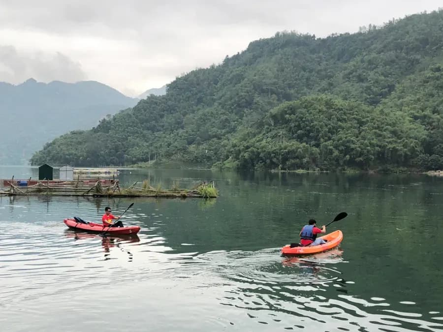 Kayaking on the Da River, surrounded by breathtaking mountain scenery and calm waters