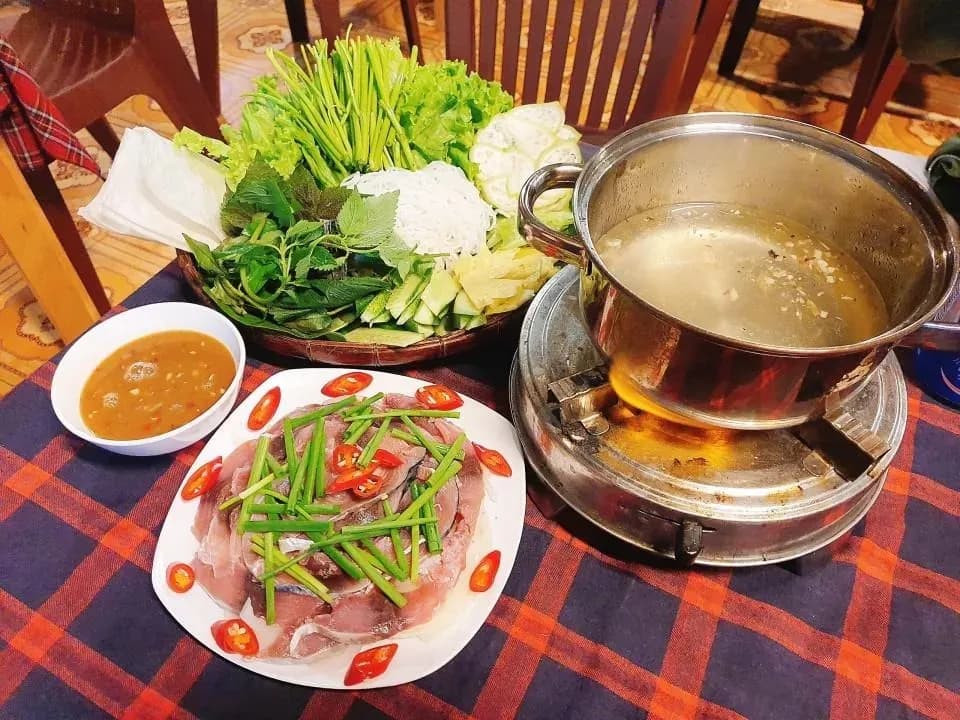 Catfish with vinegar hotpot shines amidst Vietnamese culinary delights.