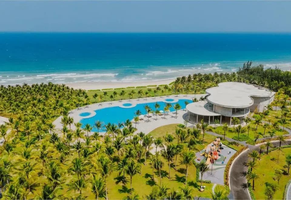 The Aquamarine Resort viewed from above, set against the stunning blue sea at Bai Dai Beach.