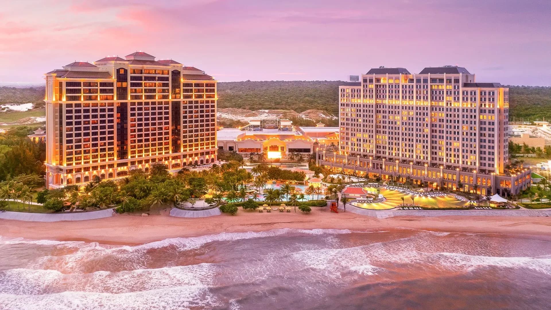 Luxurious seaside resort with modern architecture and sparkling lights.