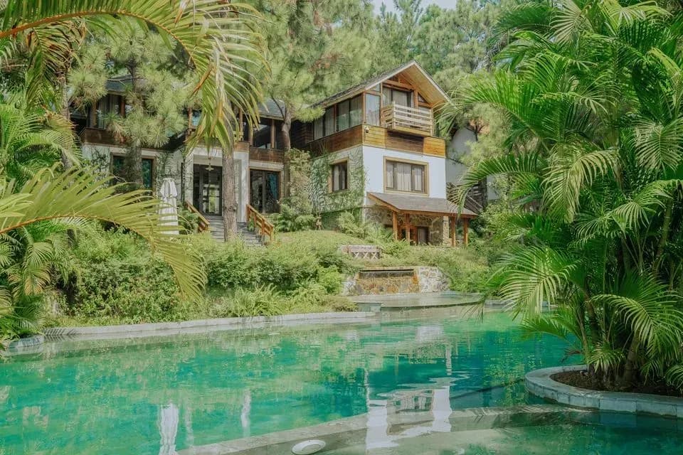 A beautiful house nestled among lush greenery and a stunning pool at Amaya Home Sóc Sơn.