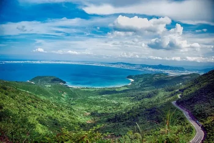 Hải Vân Pass from above with stunning blue seas and lush mountains.