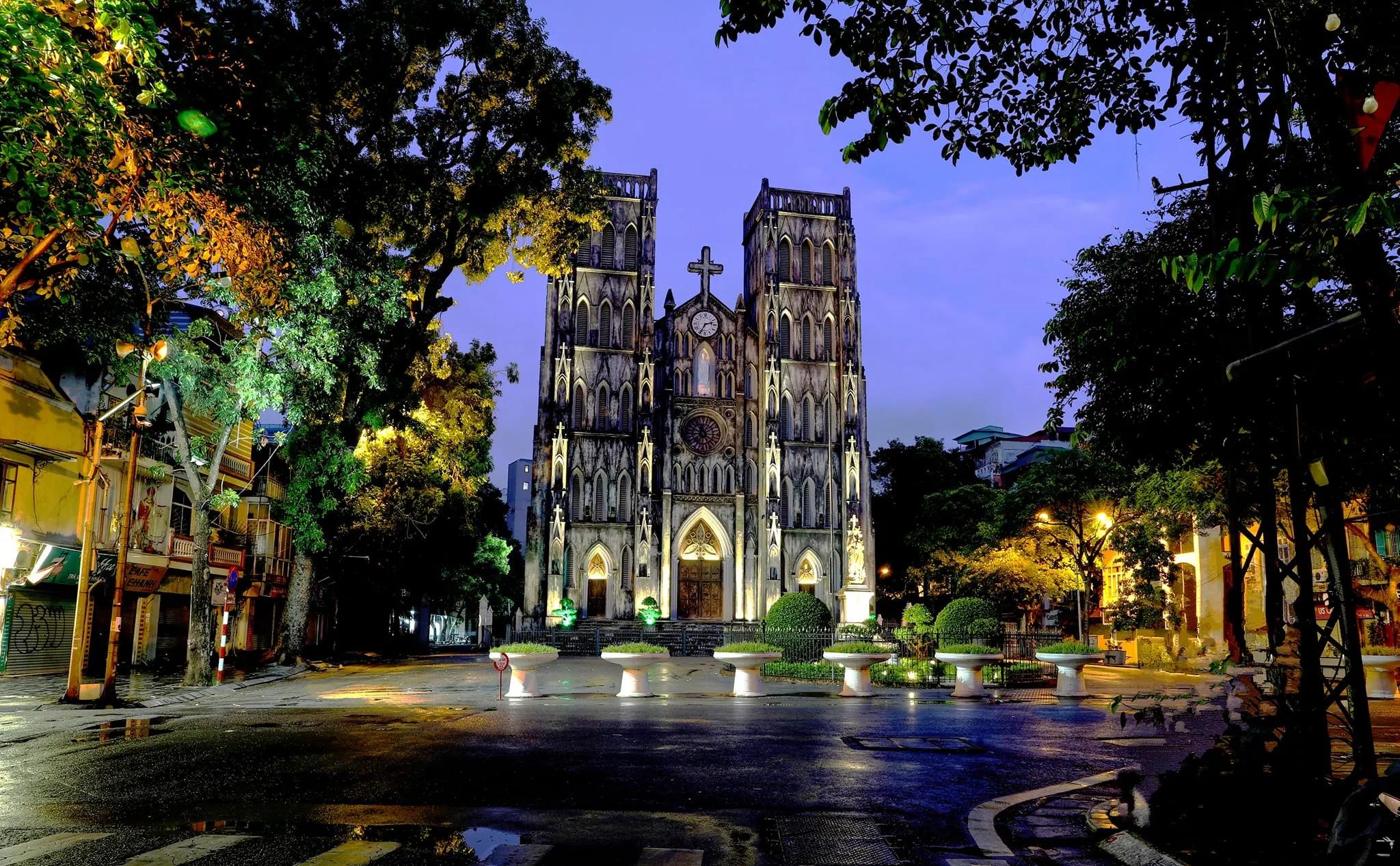 Hanoi Cathedral, or St. Joseph’s Cathedral, in the heart of the city, its neo-Gothic architecture towering against the blue sky