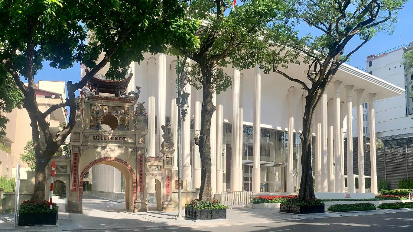 Ho Guom Opera, a stunning blend of modern and classical architecture, illuminated at night, symbolizing a new cultural landmark in Hanoi