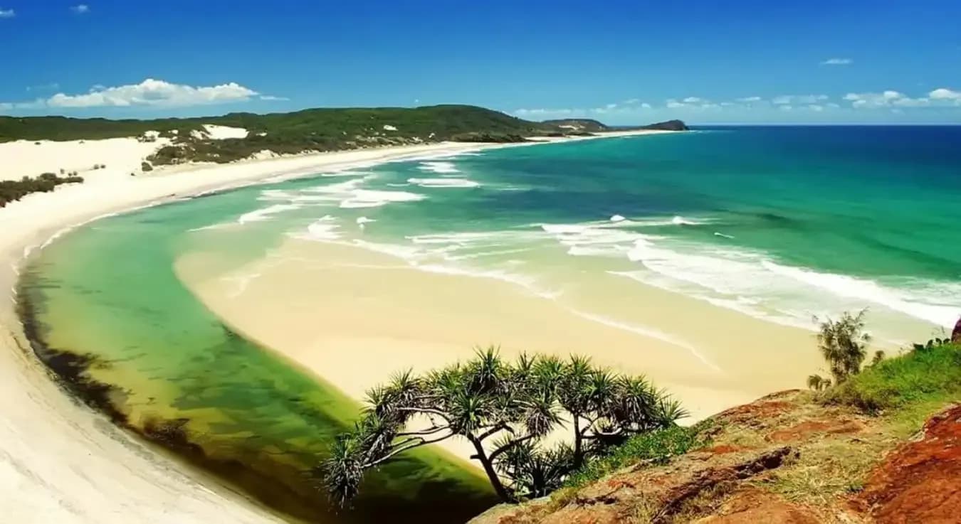 A picturesque view of Hon Thi's turquoise waters and fine white sands.
