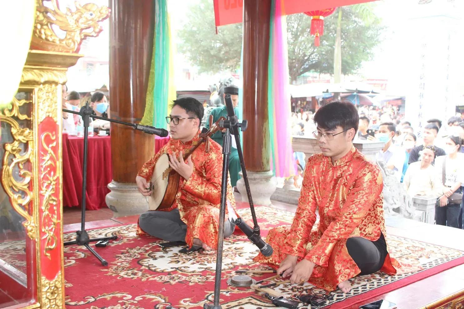 Artists performing Chau Van at Phu Day Festival.
