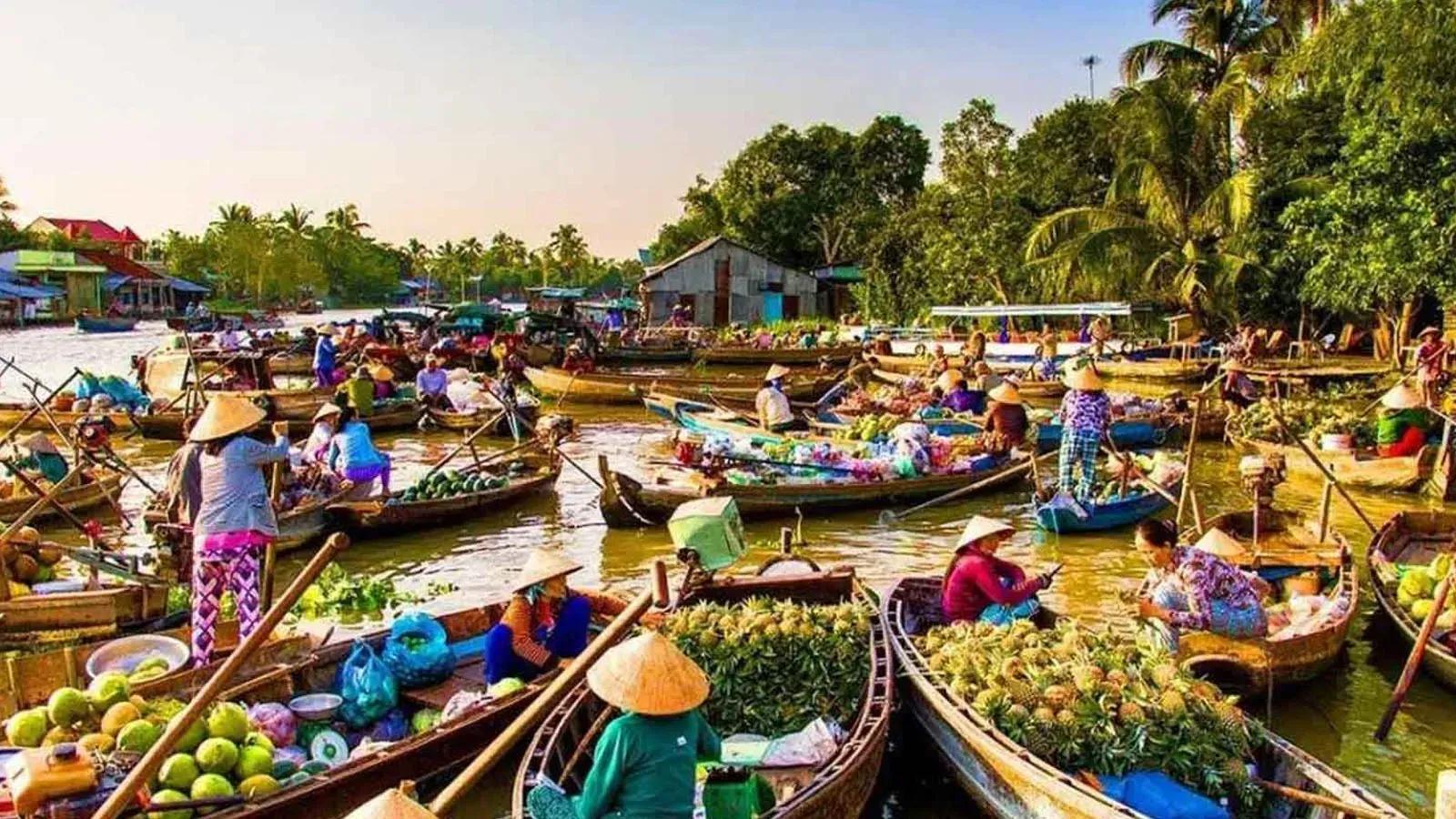 Long Xuyen Floating Market bustling with boats full of goods, locals actively trading.