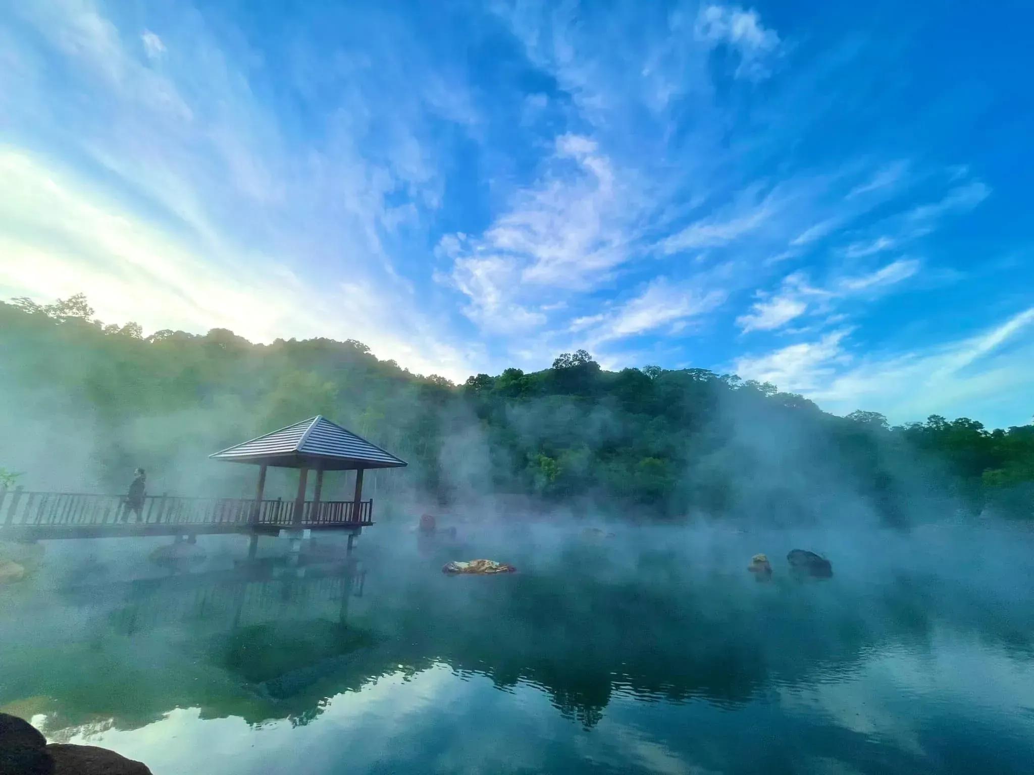 Misty view at Bang hot springs, with gentle steam rising from the water surface.