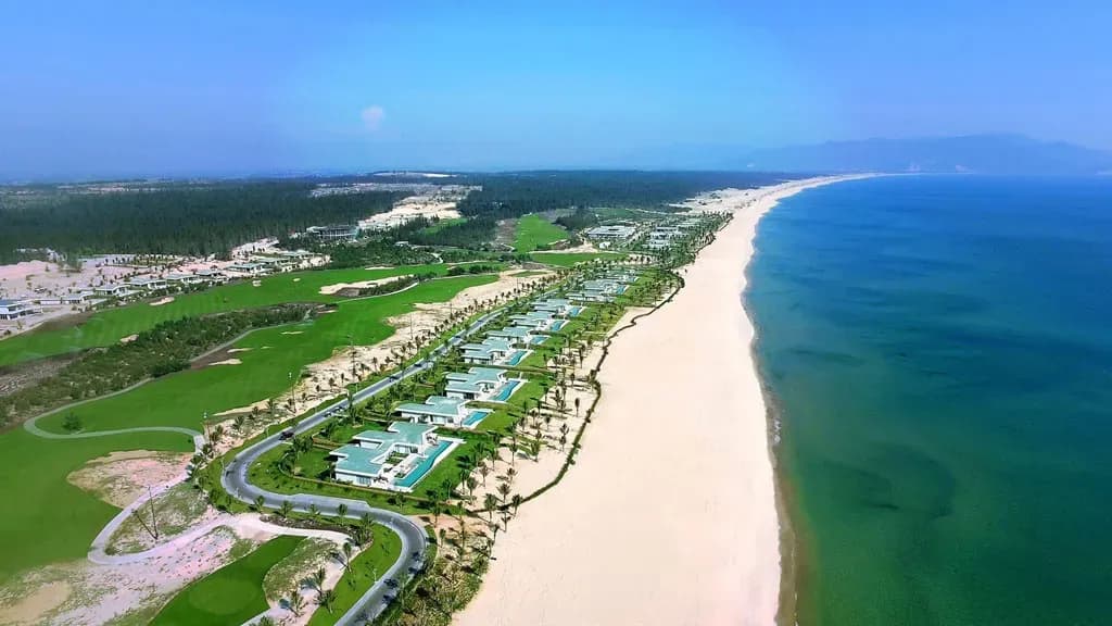The pristine white sands of Tuy Hoa Beach stretch along the azure coastline.