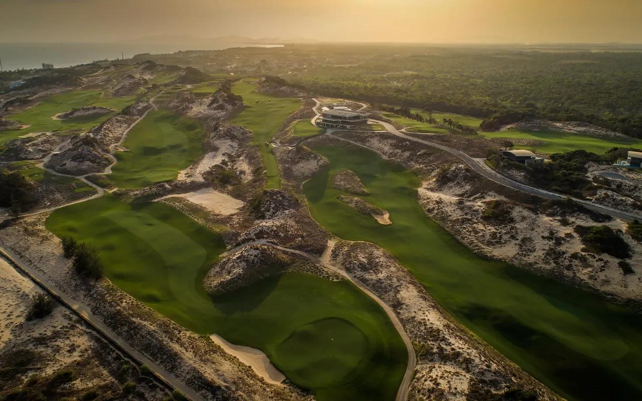 The Buff Grand Ho Tram golf course, with its beautifully manicured greens and scenic coastal views, set against the backdrop of the blue ocean