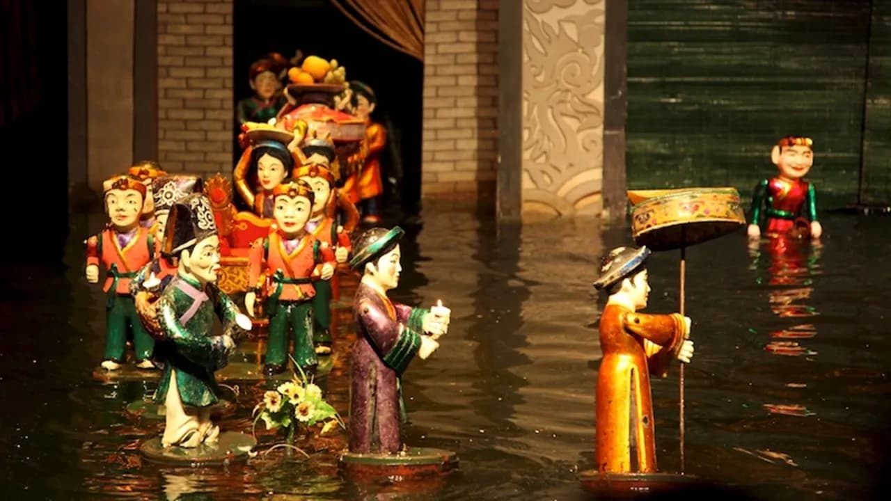 Traditional Vietnamese water puppets performing on a water stage with vibrant lighting