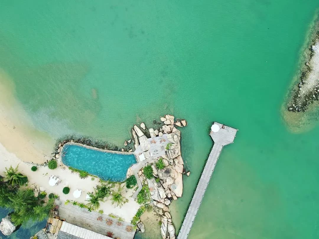 Aerial view of Ninh Van Bay showcasing turquoise waters and untouched natural landscape.