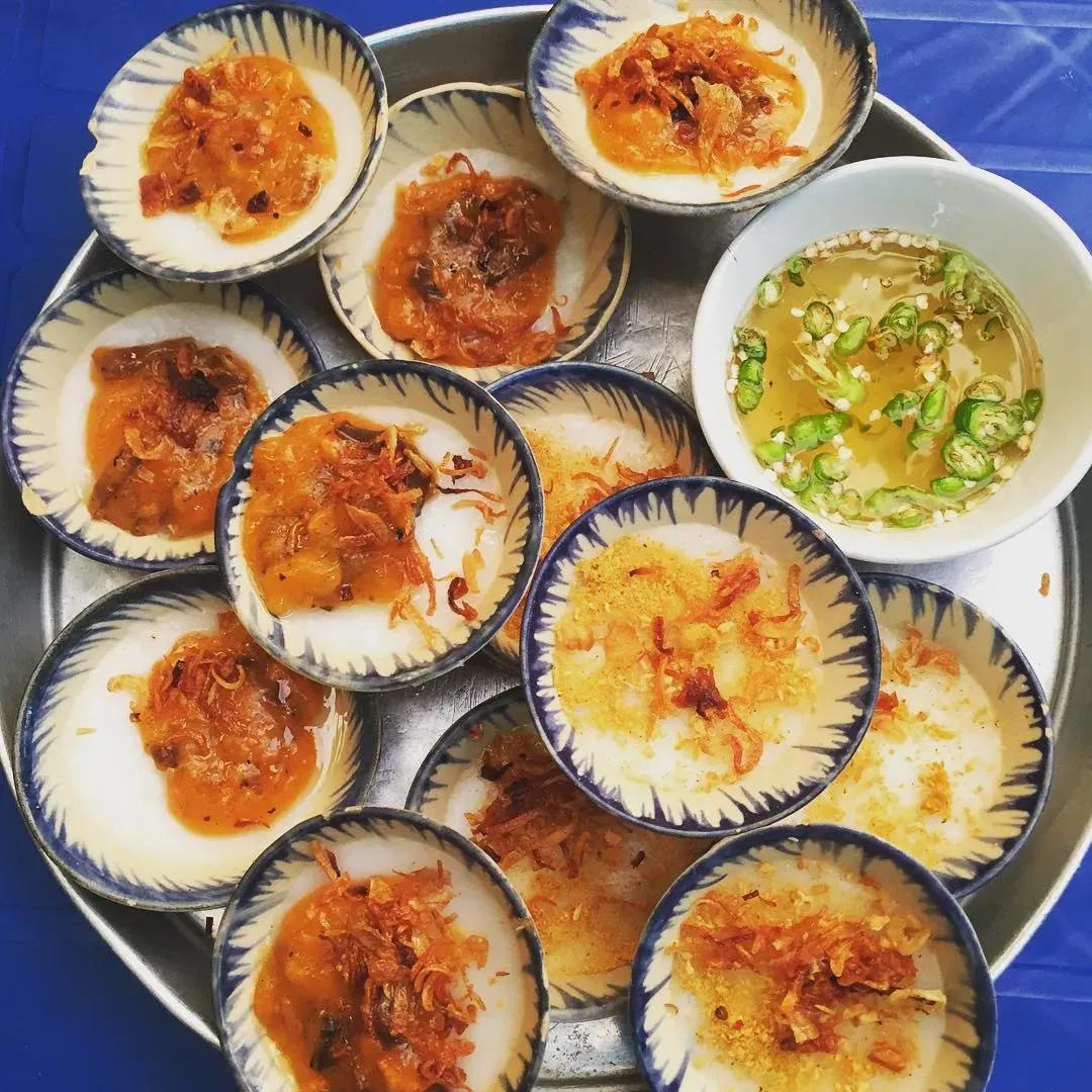 A plate of Banh Beo with shrimp paste, shallots, and chili fish sauce.