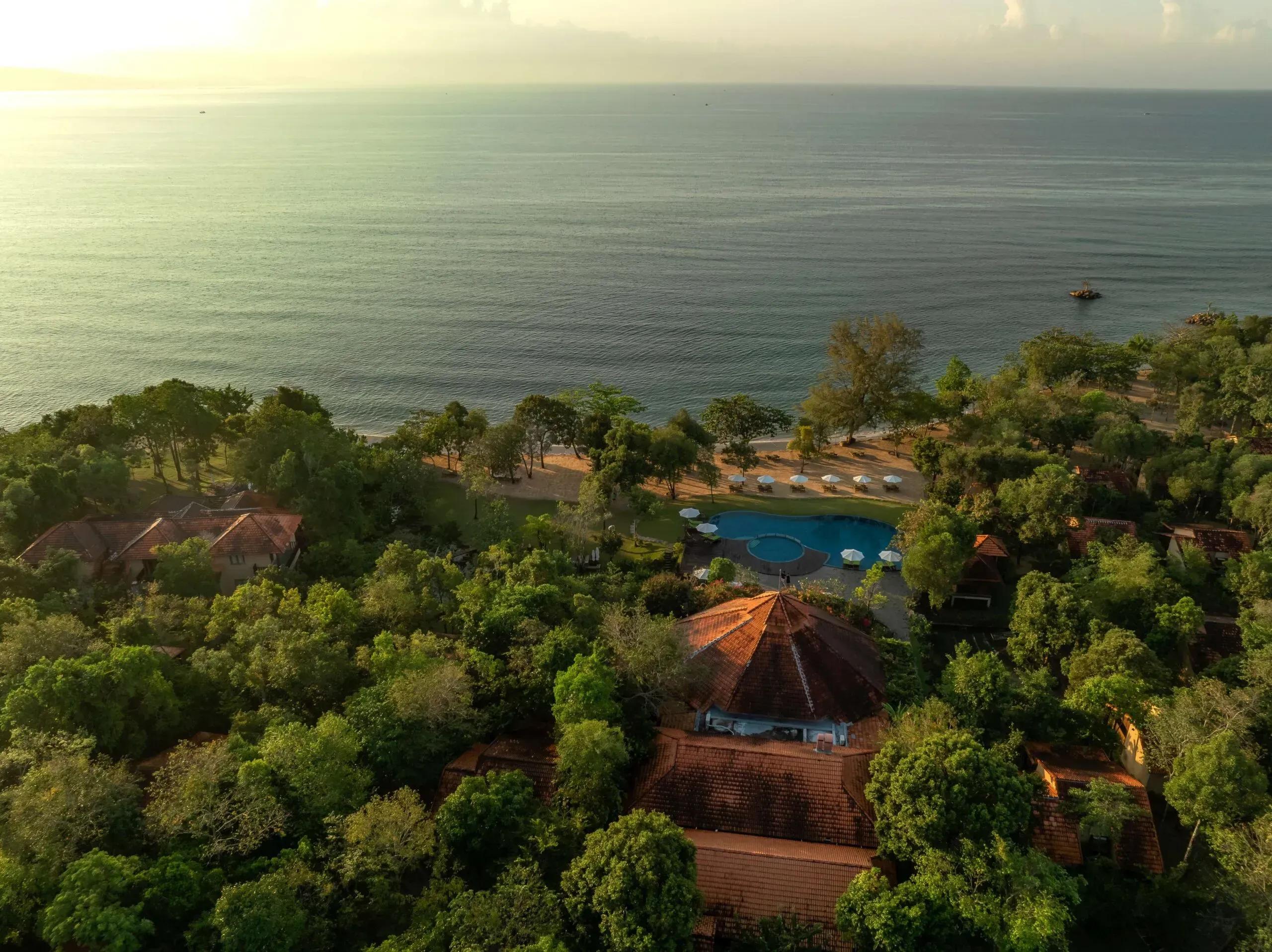 Overview of lush resort by Phu Quoc beach, blending with nature.