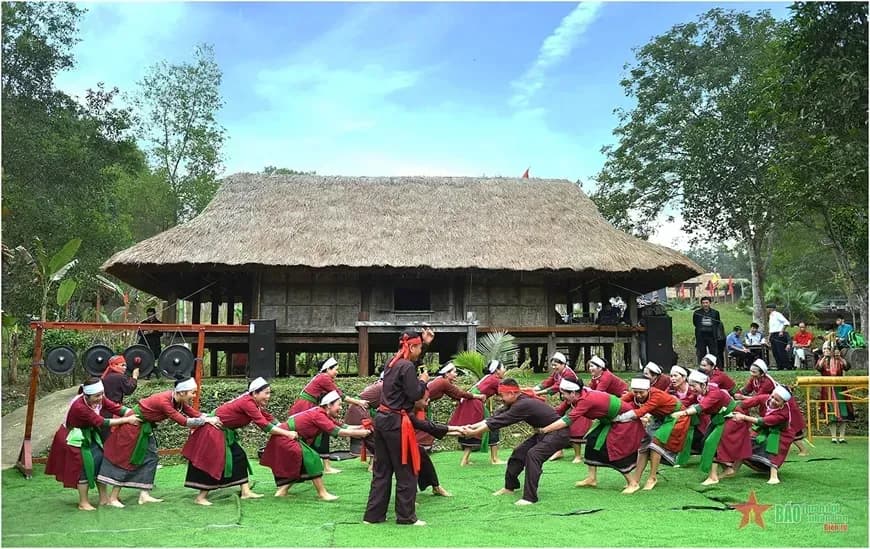 The Tho people performing traditional arts at a cultural festival.