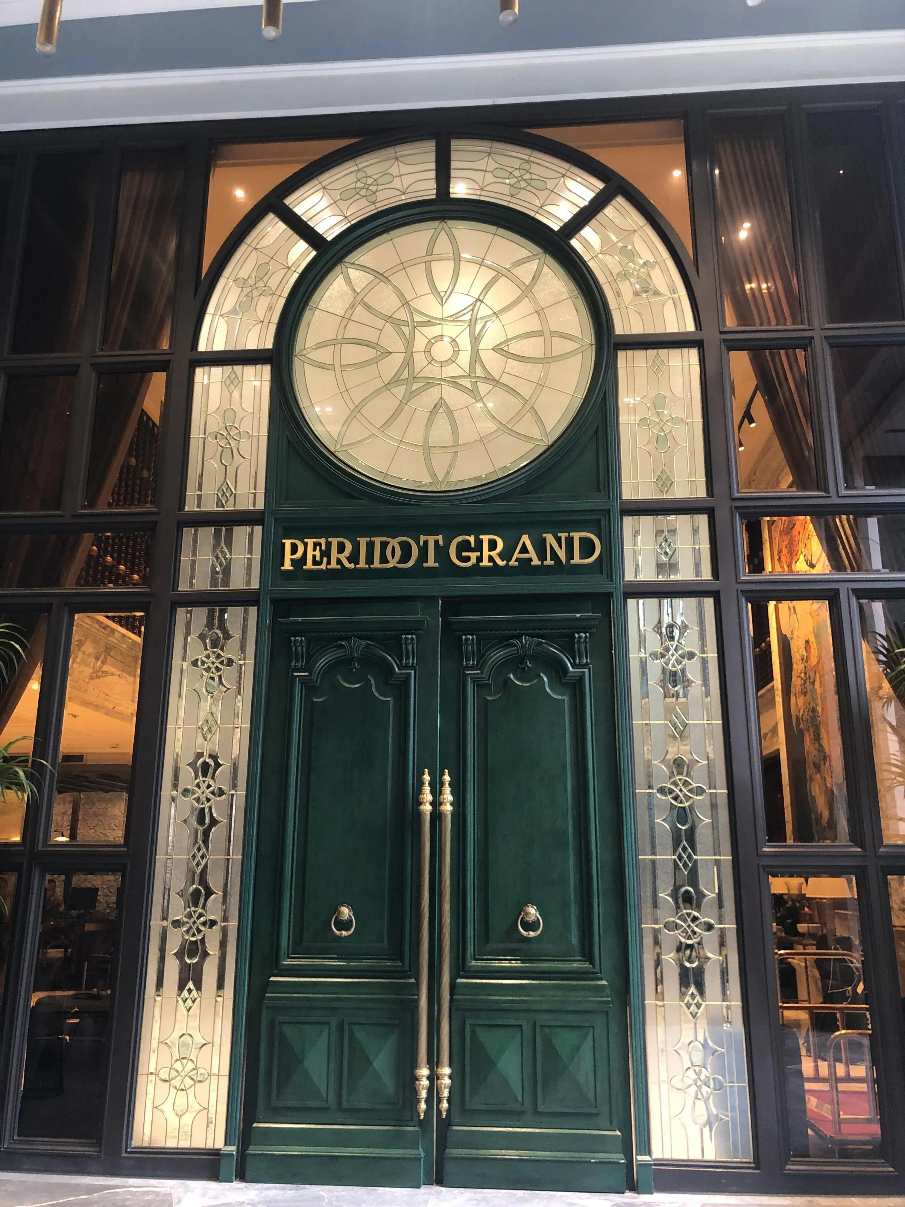 The main entrance showcases a splendid architectural design, exuding elegance from the first glance.