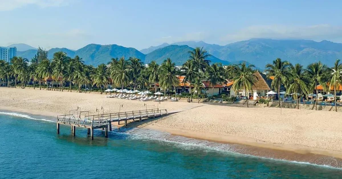 White sandy beach and palm trees in Nha Trang