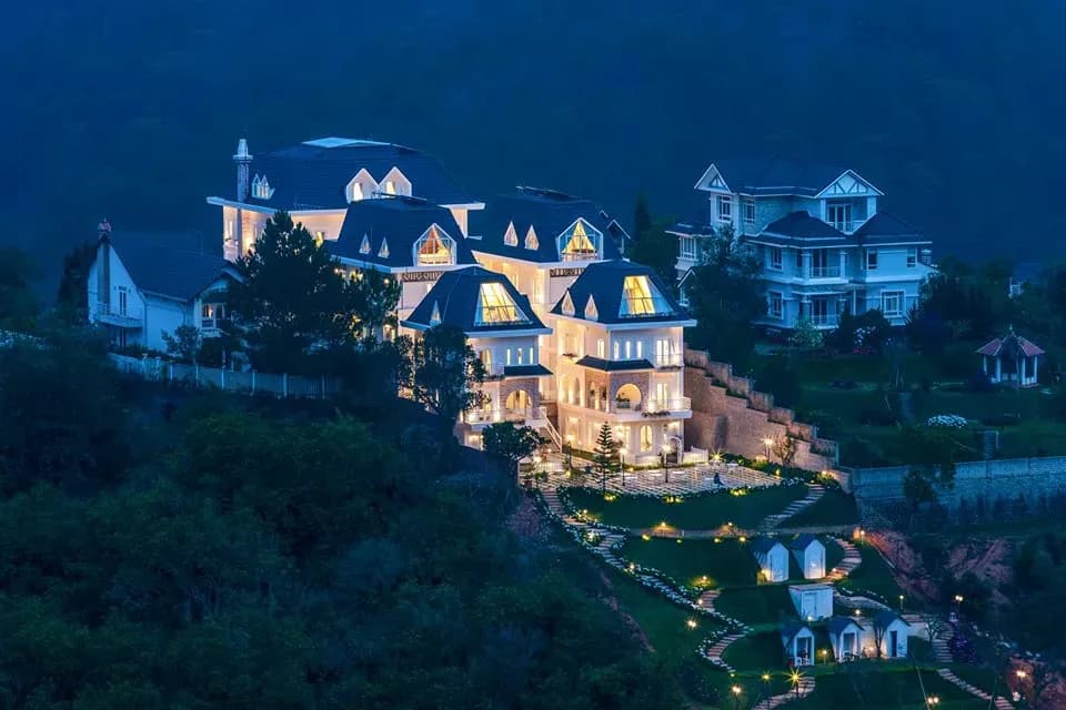 Dalat De Charme Village shines brightly in the night lights.