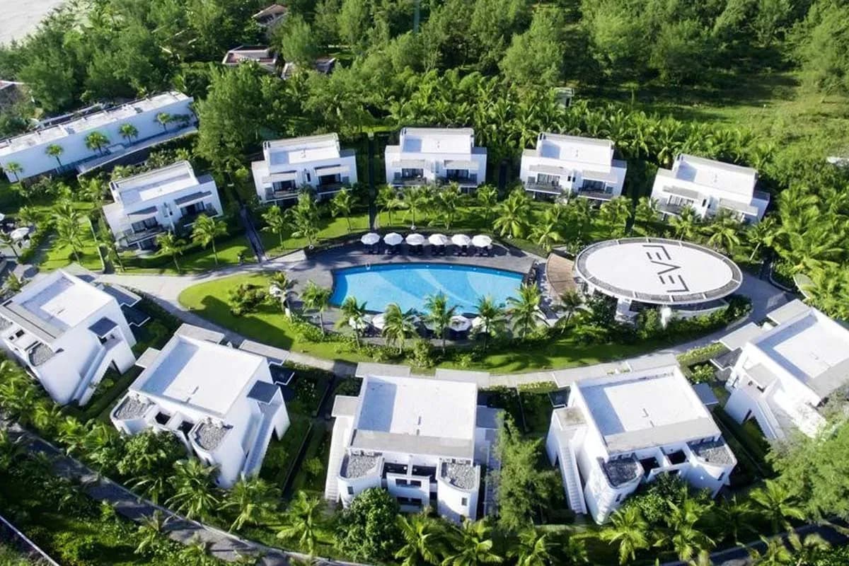 Lush resort with modern villas nestled in nature.