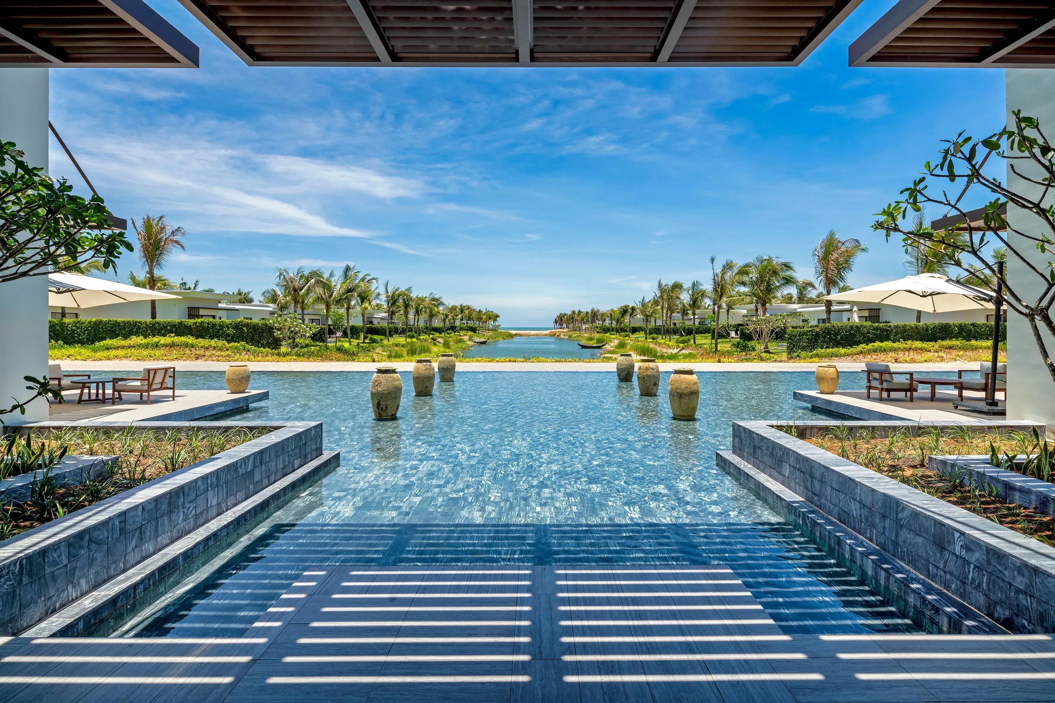 Luxury resort setting with a water feature and lush greenery