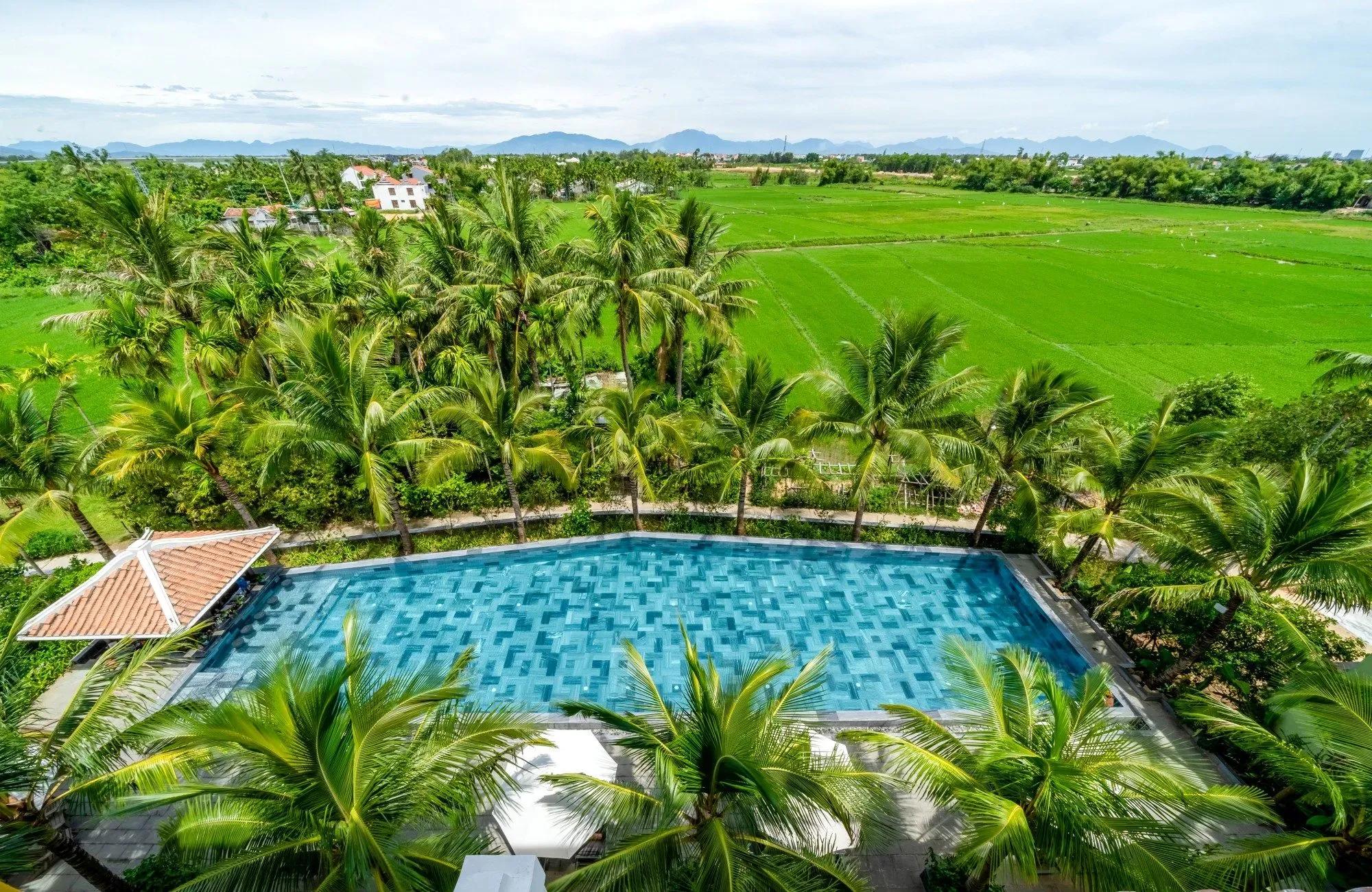 Romantic turquoise pool amidst coconut groves at La Siesta.