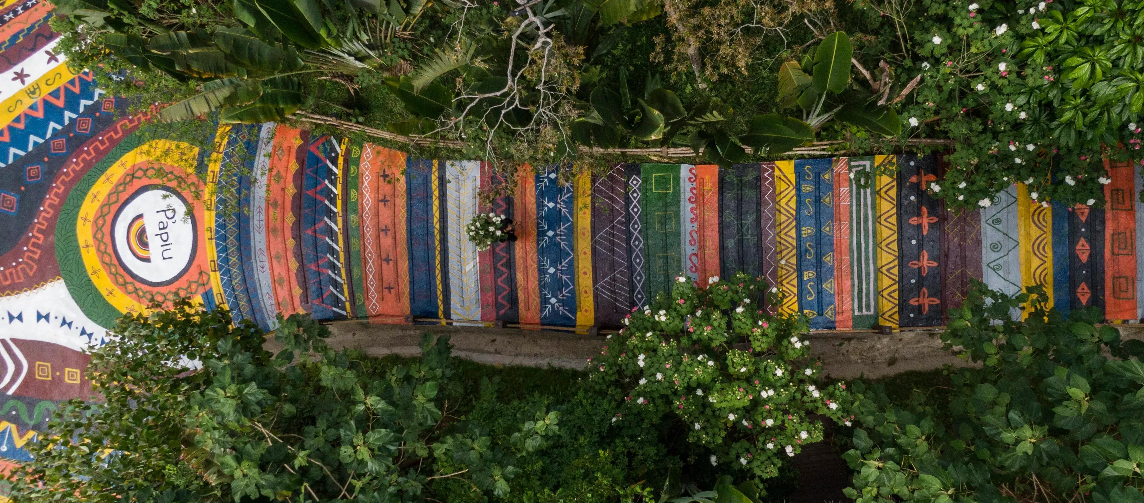 Colorful brocade path at P'apiu Resort, a striking feature amid lush nature.