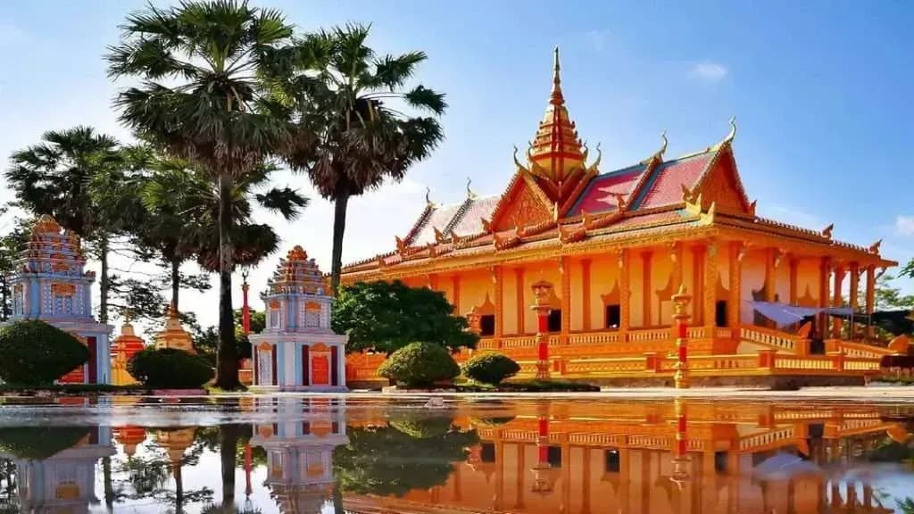 Bac Lieu's Khmer Temple: Radiant Architecture Against Blue Skies.