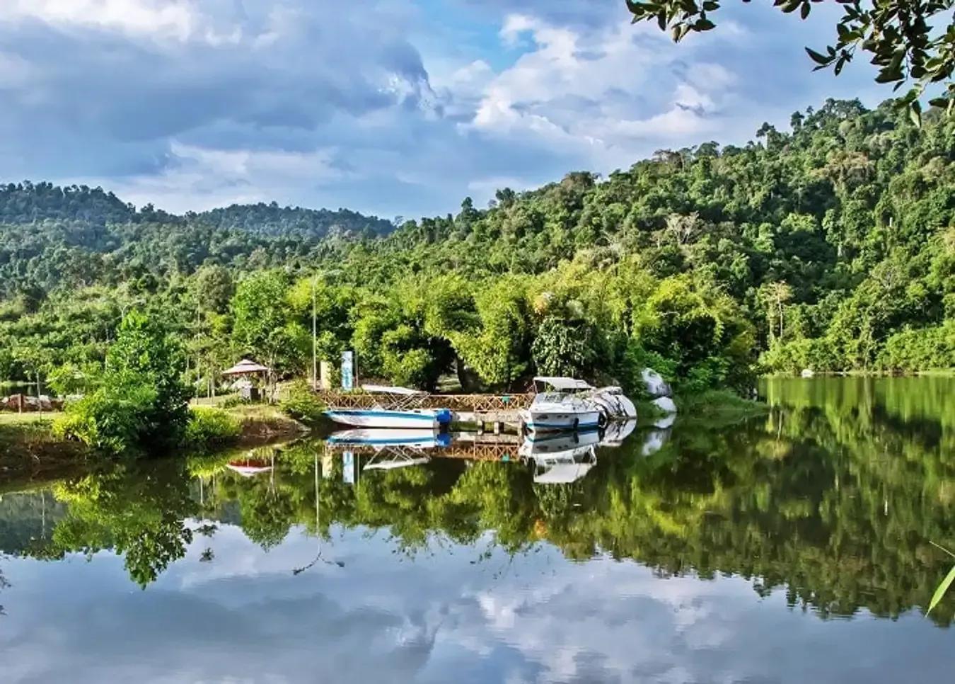 Lush green landscape with crystal-clear lake at Madagui.