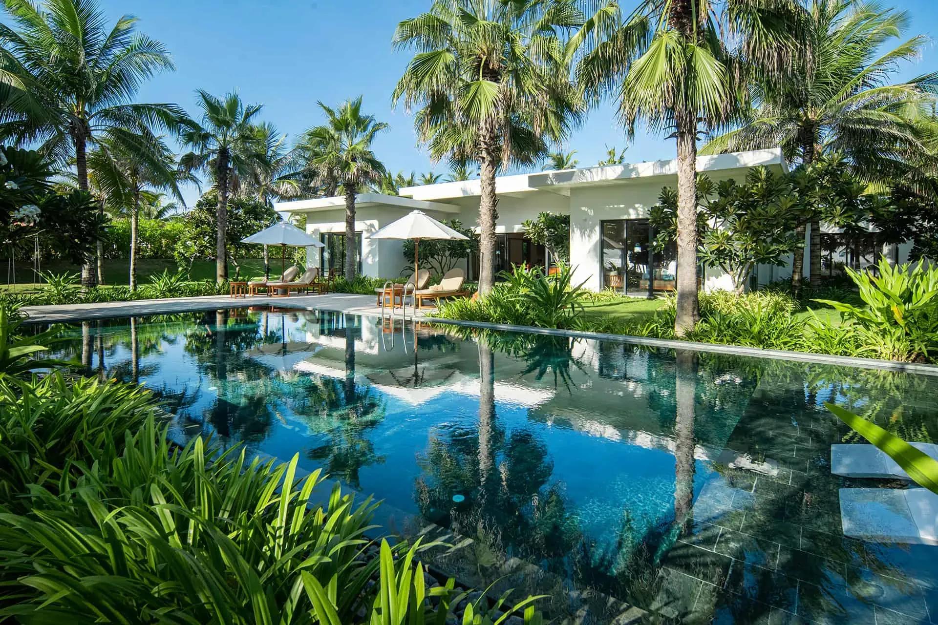 Luxury villa with a private pool, surrounded by lush greenery and natural landscapes.
