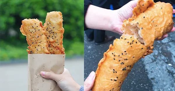 Crispy banana fritters with black sesame, a street food delight.