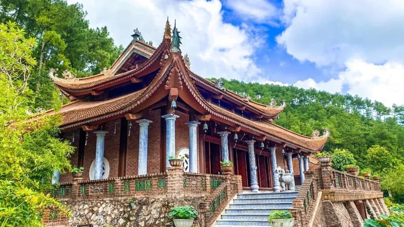 Traditional architecture of the pagoda blending with lush greenery.